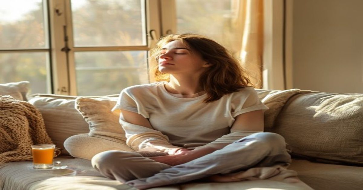Person taking a deep breath on couch, showing natural stress relief at home
